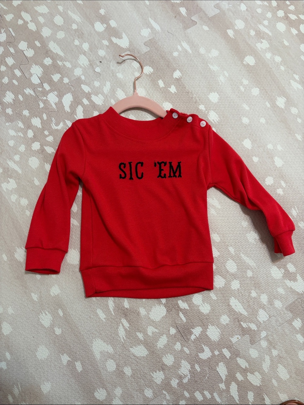 Red Kids Sweatshirt with Button Shoulder and 'SIC 'EM' Graphic
